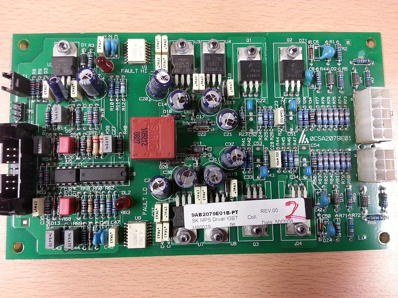 A green printed circuit board with components, illustrating the layered engineering behind storage and compression