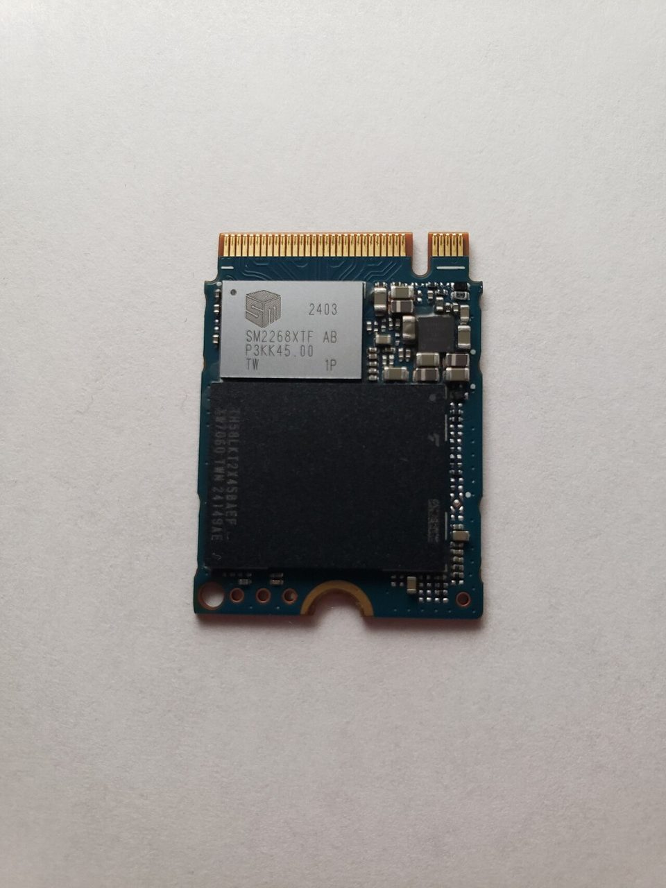 A solid-state storage module resting on a neutral surface, representing the device a game library is planned around